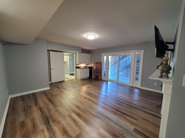 unfurnished living room featuring hardwood / wood-style flooring