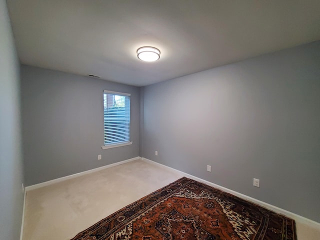 empty room with carpet flooring