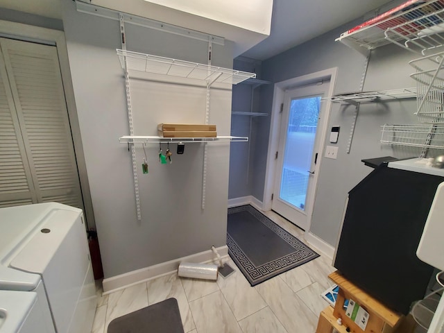 laundry room with independent washer and dryer