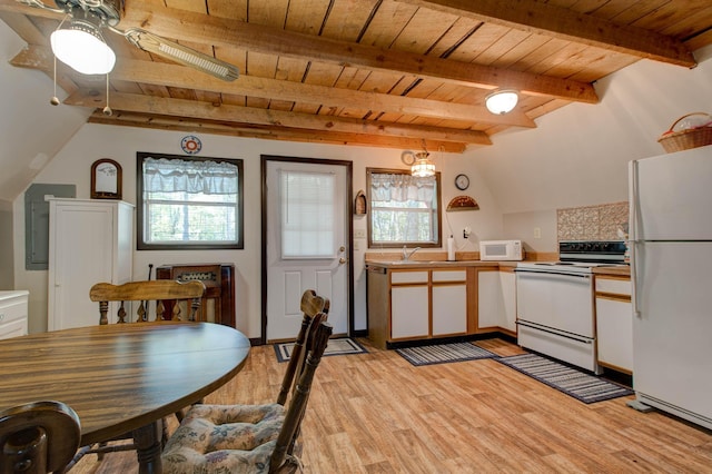 kitchen featuring light wood-type flooring, white cabinetry, white appliances, and a wealth of natural light