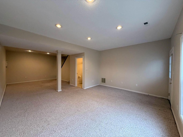 spare room featuring recessed lighting, visible vents, and baseboards