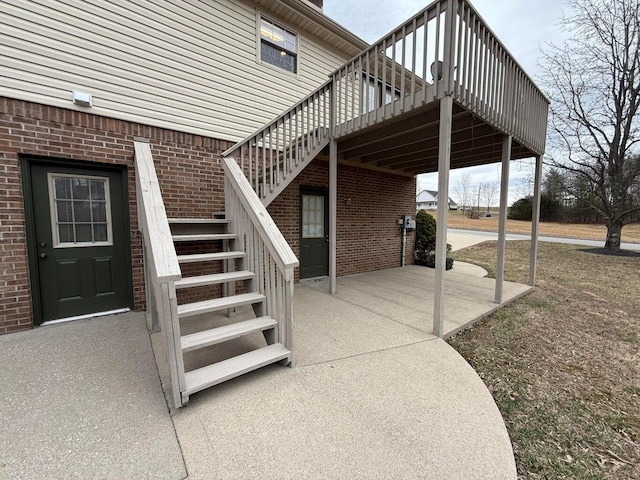 view of patio / terrace with stairway and a wooden deck