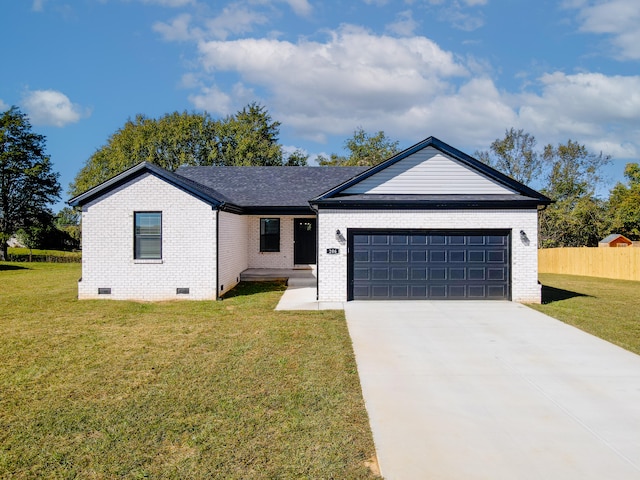 ranch-style house featuring a front yard and a garage