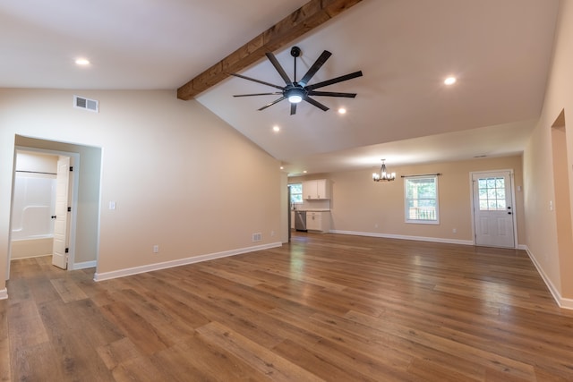 unfurnished living room with wood-type flooring, beamed ceiling, ceiling fan with notable chandelier, and high vaulted ceiling