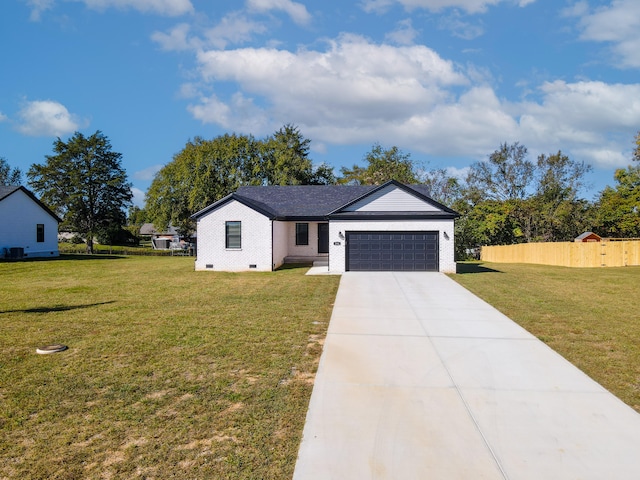 modern farmhouse featuring a garage and a front lawn