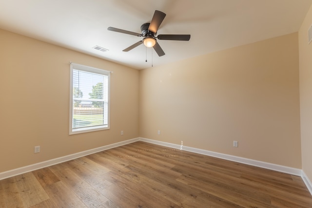 spare room featuring ceiling fan and wood-type flooring