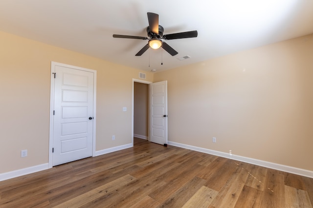 unfurnished bedroom featuring wood-type flooring and ceiling fan