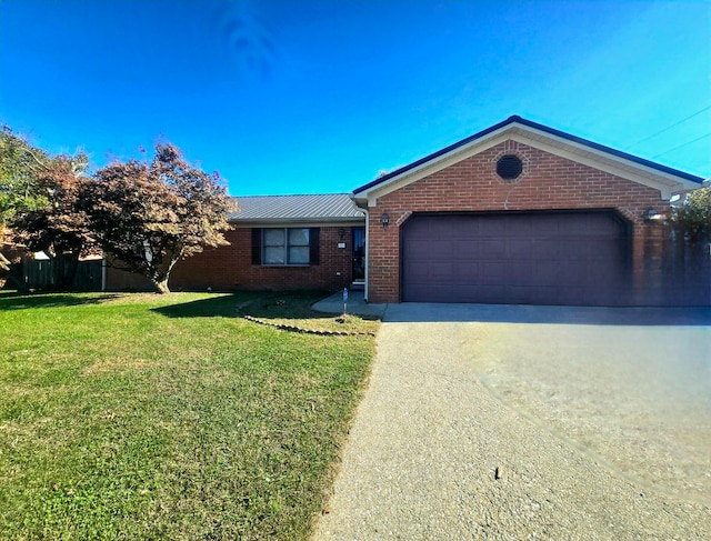 ranch-style home with a front yard and a garage