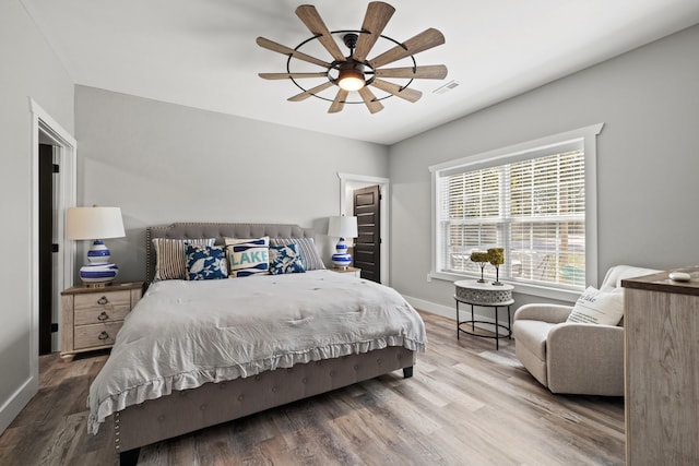 bedroom featuring ceiling fan and wood-type flooring