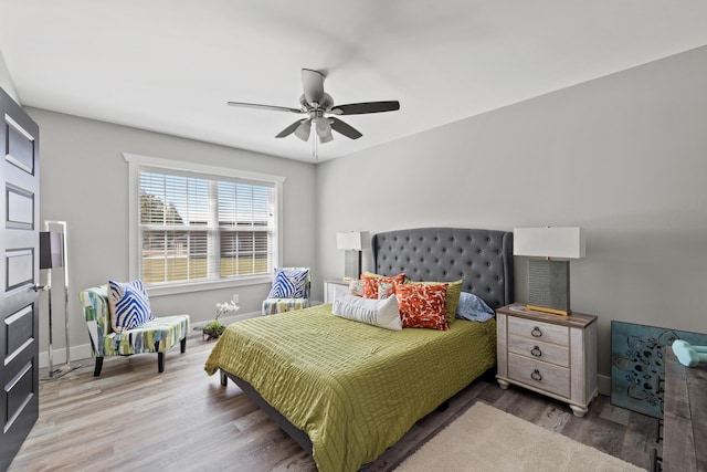 bedroom featuring hardwood / wood-style flooring and ceiling fan