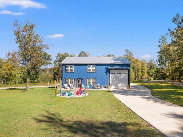 view of front of home featuring a front lawn and a garage