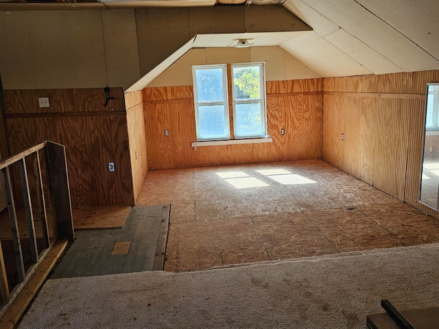 additional living space featuring vaulted ceiling