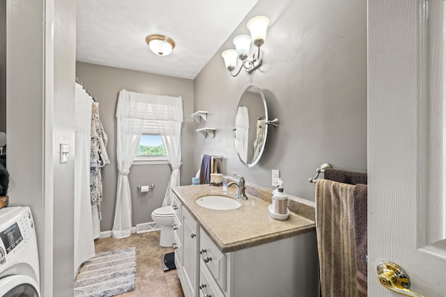 bathroom featuring vanity, toilet, a textured ceiling, and tile patterned flooring