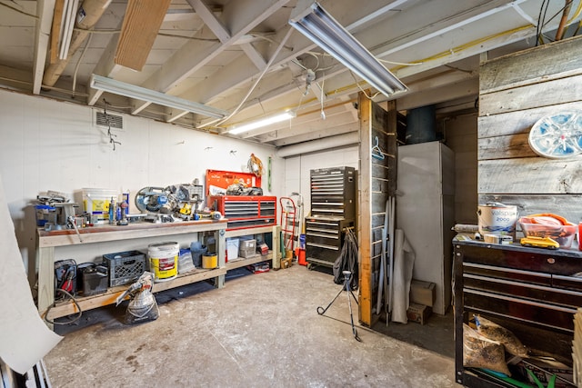 basement with a workshop area