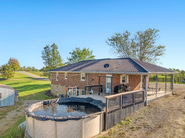 back of property featuring a patio and central AC