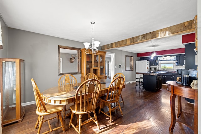 dining room with a chandelier and dark hardwood / wood-style floors