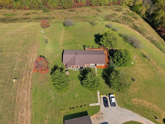 birds eye view of property with a rural view