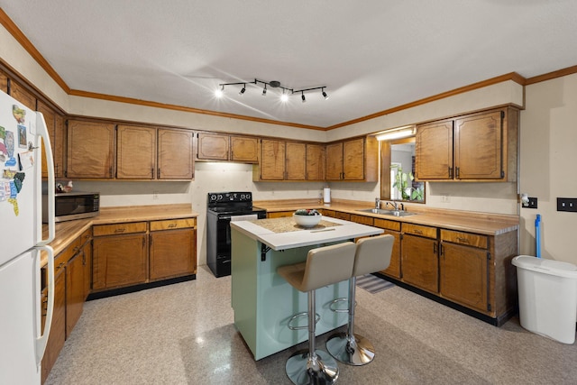 kitchen featuring black electric range oven, sink, a center island, crown molding, and white fridge