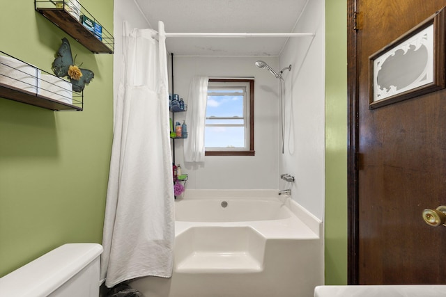 bathroom featuring toilet and shower / tub combo with curtain