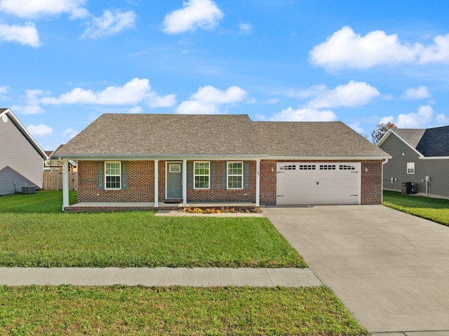 ranch-style home featuring central AC unit, a garage, a front yard, and a porch