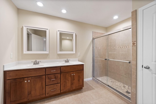 bathroom featuring vanity, walk in shower, and tile patterned flooring