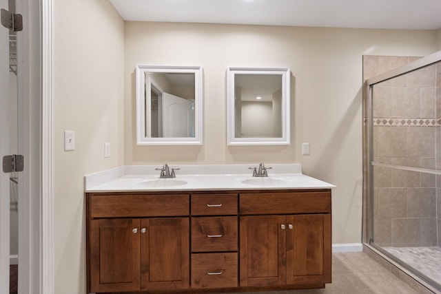 bathroom featuring an enclosed shower, vanity, and tile patterned floors