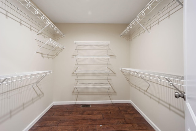 walk in closet featuring hardwood / wood-style flooring