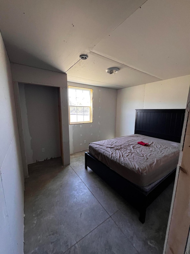 bedroom with concrete floors