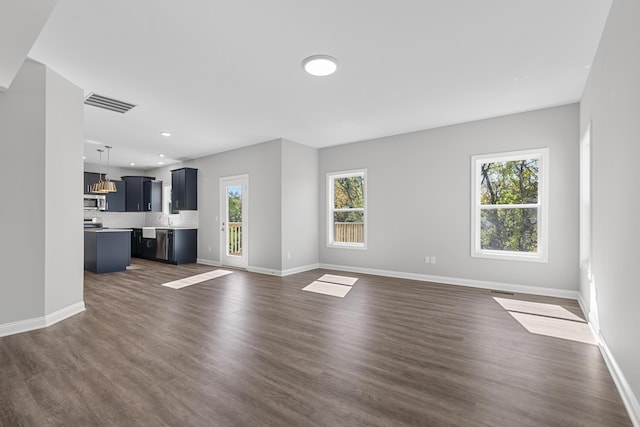 437 Friendly Ave, Nicholasville, KY 40356 - unfurnished living room featuring baseboards, recessed lighting, and dark wood-type flooring
