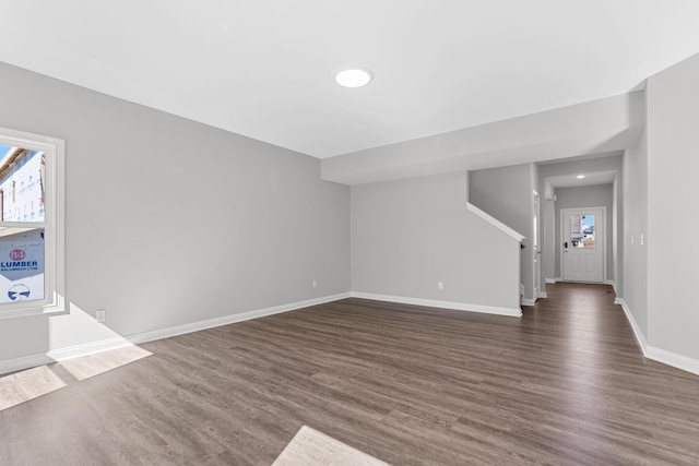 437 Friendly Ave, Nicholasville, KY 40356 - unfurnished living room with dark wood-style floors, stairway, and baseboards
