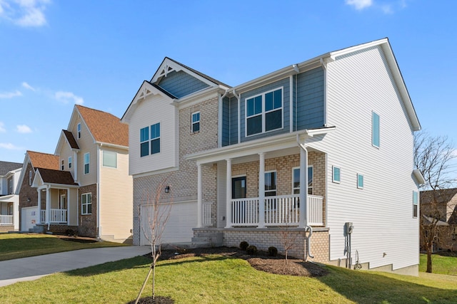 view of front of house featuring a porch, concrete driveway, a front lawn, and a garage