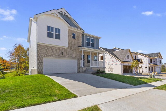 view of exterior entry featuring a porch and a garage