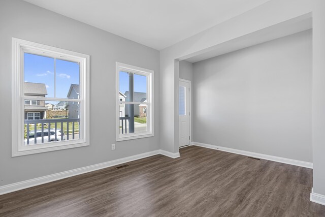 hallway featuring dark hardwood / wood-style flooring