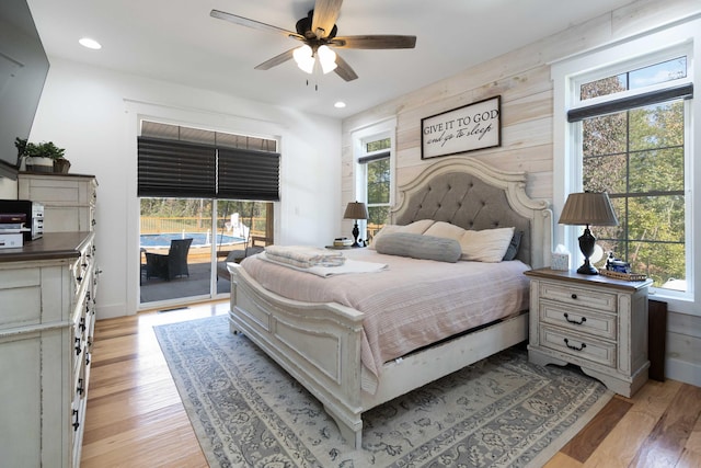 bedroom with ceiling fan, access to exterior, and light hardwood / wood-style floors