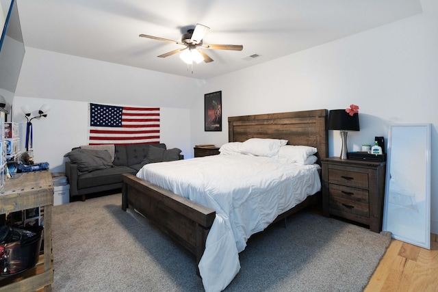 bedroom featuring hardwood / wood-style flooring and ceiling fan