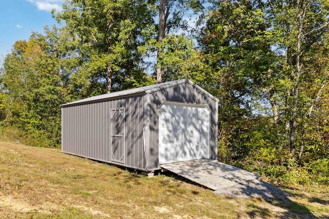 view of outdoor structure with a lawn