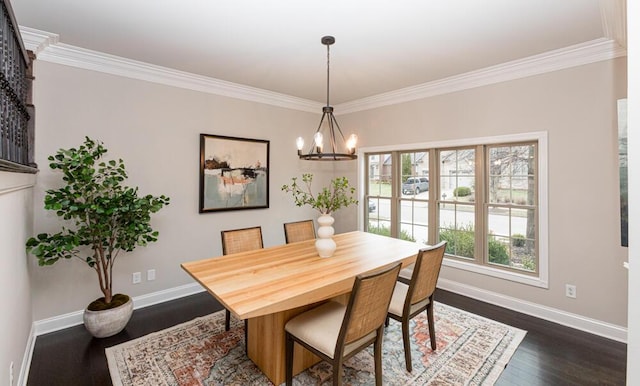 dining space featuring an inviting chandelier, baseboards, dark wood-type flooring, and ornamental molding