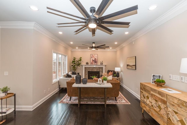 office featuring wood-type flooring, a fireplace, and ornamental molding