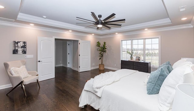 bedroom featuring baseboards, a raised ceiling, ornamental molding, wood finished floors, and recessed lighting