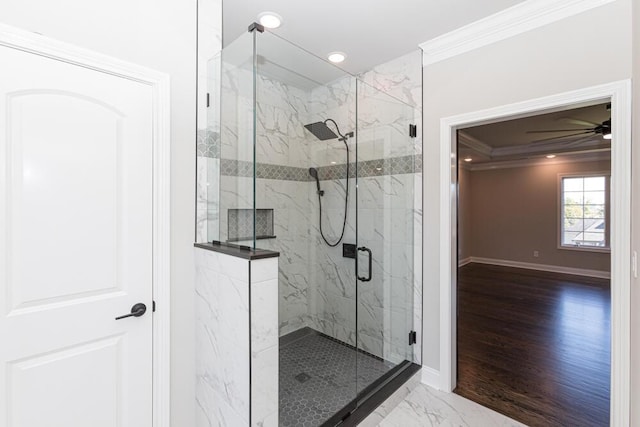 full bathroom with marble finish floor, ornamental molding, a marble finish shower, and baseboards