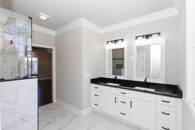 full bath with marble finish floor, tiled shower, a sink, and baseboards