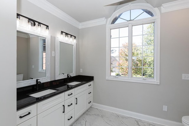 full bath featuring crown molding, marble finish floor, a sink, and toilet