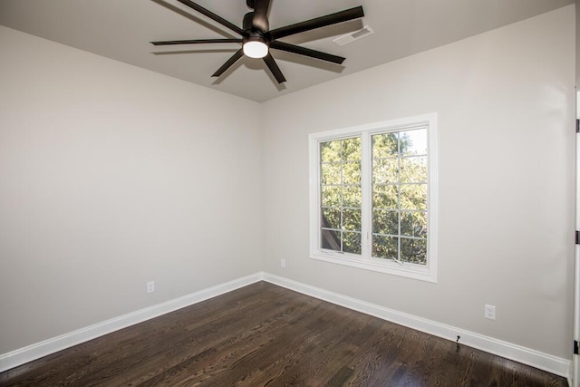 unfurnished room with a ceiling fan, baseboards, visible vents, and dark wood-style flooring