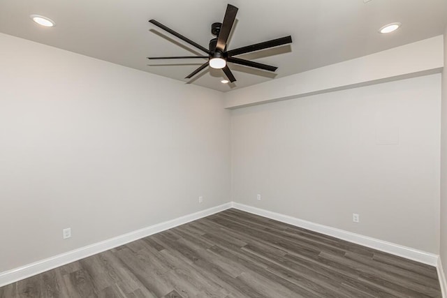 unfurnished room with dark wood-style floors, recessed lighting, a ceiling fan, and baseboards