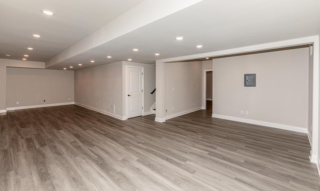 basement with recessed lighting, baseboards, and wood finished floors