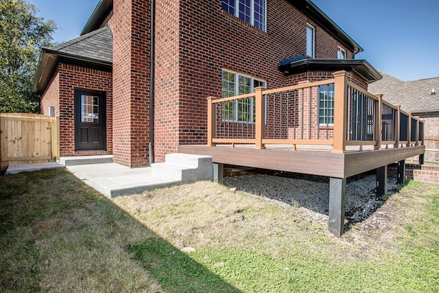 back of house with a wooden deck and brick siding