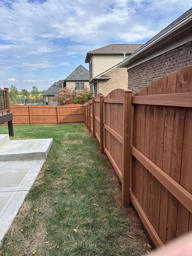 view of yard with a fenced backyard