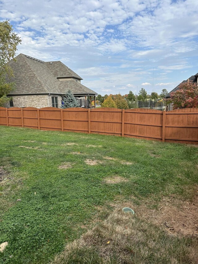 view of yard with fence