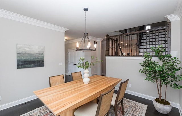 dining space featuring crown molding, dark wood-style flooring, and baseboards