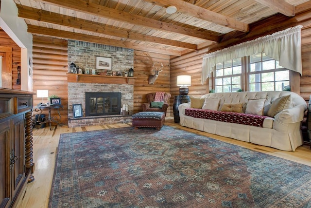 living room featuring light wood-type flooring, wooden ceiling, beam ceiling, log walls, and a fireplace